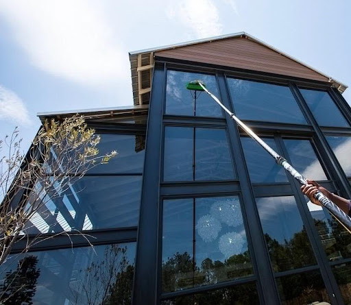 Man cleaning a window